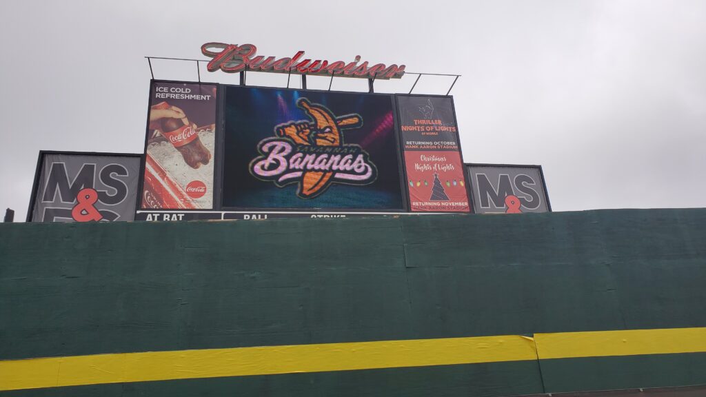 Ballpark scoreboard showing the Savannah Bananas logo during a game against the Party Animals in March 2021