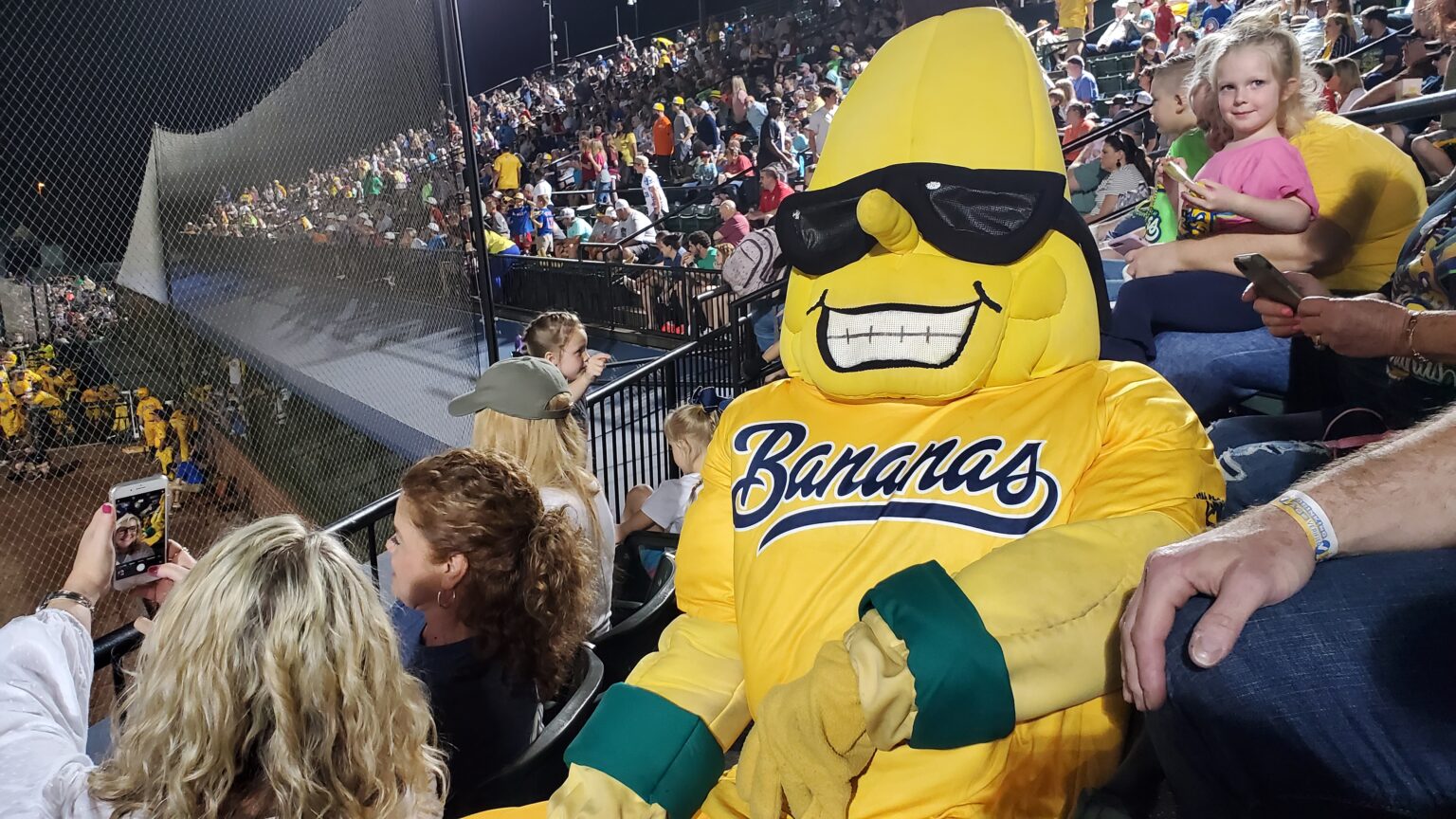 Split, the Savannah Bananas mascot in a banana costume and sunglasses, during a 2021 game
