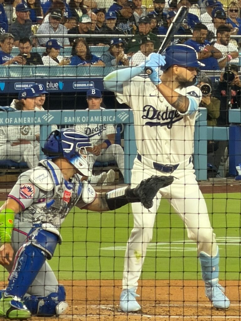 Andy Pages in a Dodgers uniform in the batter's box at Dodger Stadium.